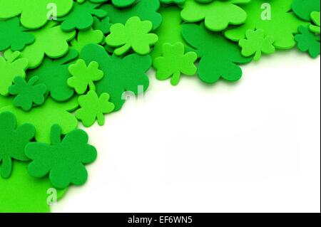 St Patricks Day shamrock corner border over a white background Stock Photo