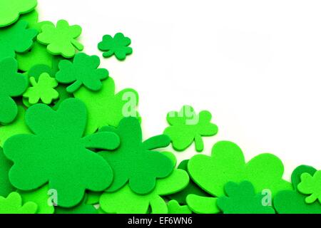 St Patricks Day shamrock corner border over a white background Stock Photo