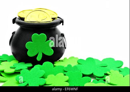 St Patricks Day Pot of Gold and shamrocks over white Stock Photo