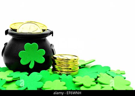 St Patricks Day Pot of Gold and shamrocks over white Stock Photo