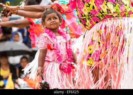 A child in traditional dress with Torres Strait Islander women dancers performing at the Yabun Festival on Australia Day 2015. Stock Photo