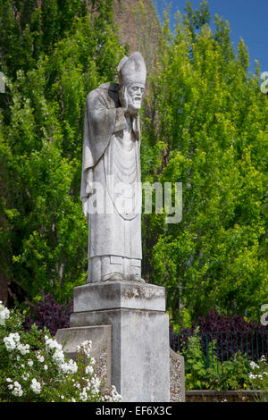 Statue of Saint Denis holding his own head after being beheaded for his Christian faith, Montmartre, Paris France Stock Photo