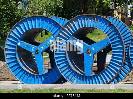 Wooden Spool With Fiber Optic Cable For Fast Internet Ready To Be Laid In  Narrow Trenches In The Ground On A Meadow Infrastructure Expansion In The  Countryside Stock Photo - Download Image