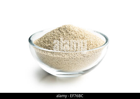 dry yeast in bowl on white background Stock Photo