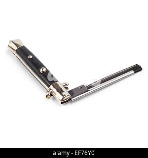 folding metal comb in the shape of a knife isolated on white bac Stock Photo