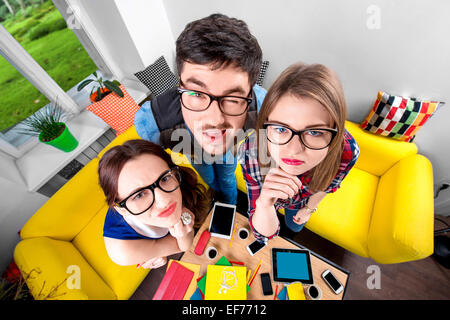 Three funny nerds together Stock Photo