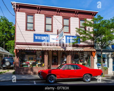 A Pontiac GTO parked outside a hardware store on Main Street in the village of Greenport, Suffolk County, Long Island, NY, USA Stock Photo