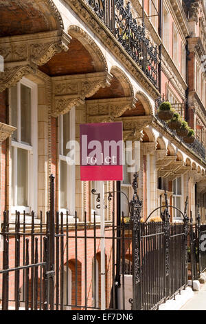 For sale sign outside expensive row of terraced houses, London Stock Photo