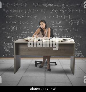 Teacher Read Math Math teacher reading book in classroom Stock Photo - Alamy