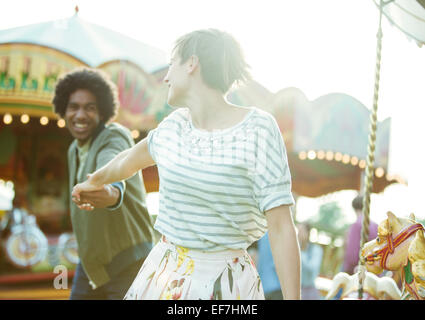 Young multiracial couple having fun in amusement park Stock Photo