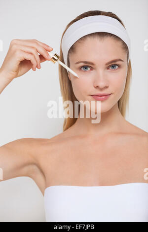 Woman applying mascara Stock Photo