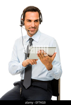 Portrait of a smiling businessman with headset and digital tablet Stock Photo
