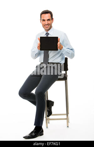 Full length portrait of a sitted businessman with digital tablet Stock Photo