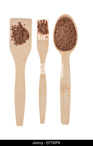 Wooden spoon, fork, paddle with  flax seed, isolated on white background Stock Photo