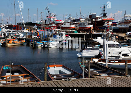 Gilleleje Harbour, North Sealand, Denmark, on a warm and sunny summer's day. Shipyard and slipway in the background. Stock Photo