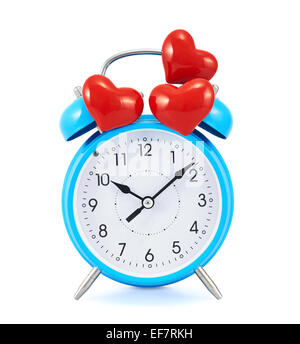 Red hearts over the alarm clock Stock Photo
