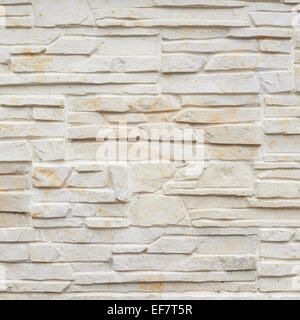 Wall of carved limestone bricks Stock Photo