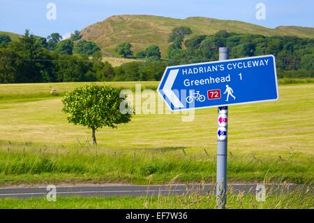 Sign post to Haltwhistle  looking across the B6318 Hadrian's Wall Cycleway sign near Greenhead Cumbria England United Kingdom Stock Photo