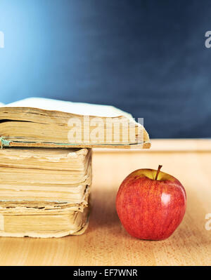 Apple, books and blackboard composition Stock Photo