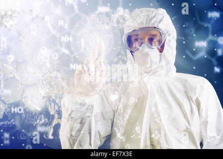 Chemical Scientist in Protective Work wear Analyzing Formula on Virtual Screen during Chemical Test Stock Photo