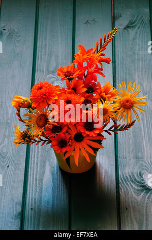 An orange and yellow themed cut flower arrangement UK Stock Photo