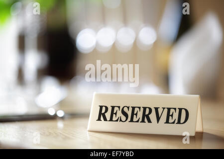 Reserved sign on restaurant table Stock Photo