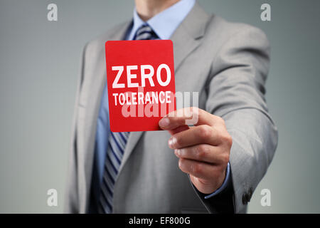 Businessman showing the zero tolerance red card Stock Photo