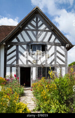 Tudor period farmhouse and colourful garden forms part of Mary Arden's Farm in Wilmcote, Warwickshire, England Stock Photo