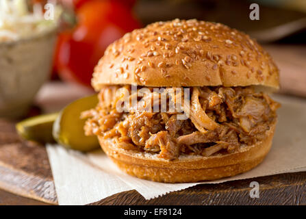 A delicious slow roasted pulled pork sandwich on a Texas style bun. Stock Photo