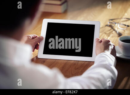Business man working on digital tablet Stock Photo
