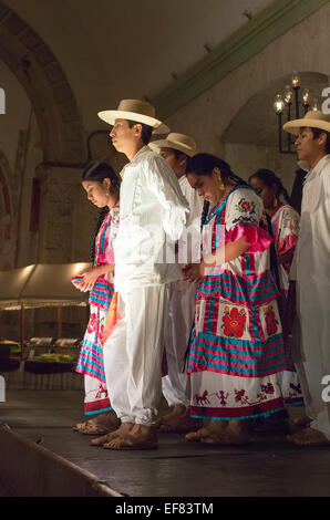 Oaxaca, Mexico - A folk dance group performs dances from eight regions of Oaxaca in the Guelaguetza Folk Dance dinner show. Stock Photo