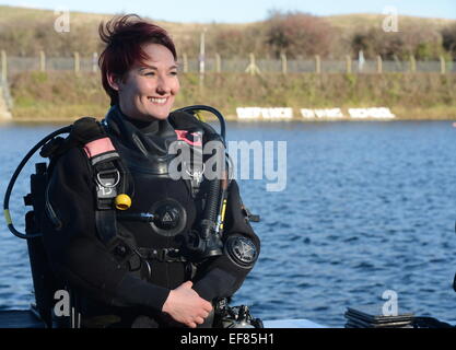 Image shows Able Rate (AB) Natasha Senn from HMS King Alfred, she is currently the only female diver in the RNR and recently became the first female reservist to qualify on her Explosive Ordnance course.    A biting wind whistled across Portsmouth Harbour as six Royal Naval Reservists plunged into the dark waters of the diving training lake at the Navy’s Horsea Island training site, swimming across the lake, completing a timed set of circuits and leaping several times from the highest platform (over 30 feet) into the water, clutching their fins to their chests.      The reservists were conduct Stock Photo