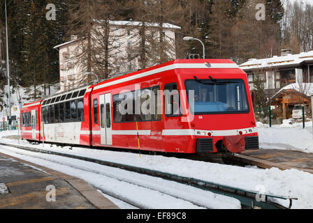 Red Mont Blanc Express train stopped at Montroc SNCF railway station near Argentiere.  This railway provides key transport links in the Chamonix Valley. Stock Photo