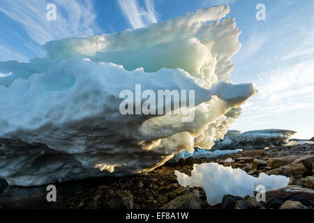 Canada, Nunavut Territory, Melting iceberg stranded by low tide along Frozen Channel at northern edge of Hudson Bay near Arctic Stock Photo