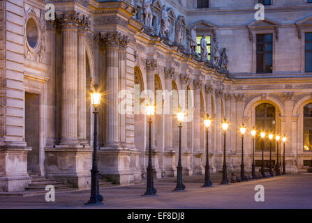 Row of lamps in the courtyard of Musee du Louvre, Paris France Stock Photo