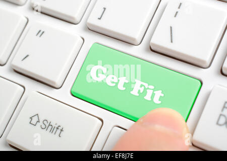 Pressing green get fit key on keyboard Stock Photo