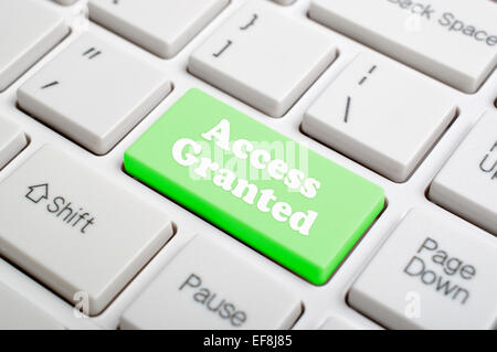 Green access granted key on keyboard Stock Photo