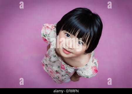 Australia, Melbourne, Portrait of young girl looking up Stock Photo