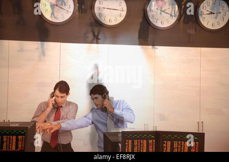 Two traders working in trading room Stock Photo