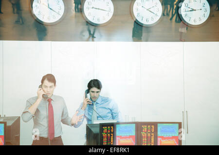 Two traders working in trading room Stock Photo