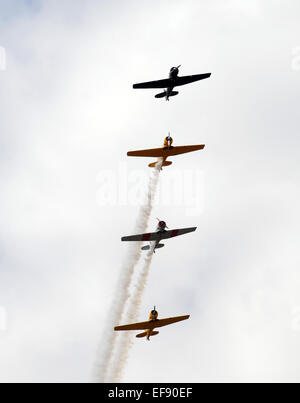 Four retro airplanes flying in formation Stock Photo