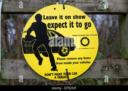 Round yellow sign warning against theft from cars. Stock Photo
