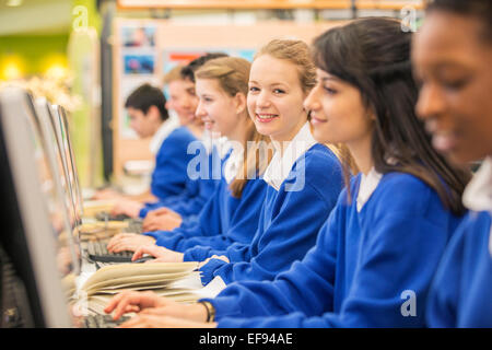 Students sitting in row during IT lesson Stock Photo