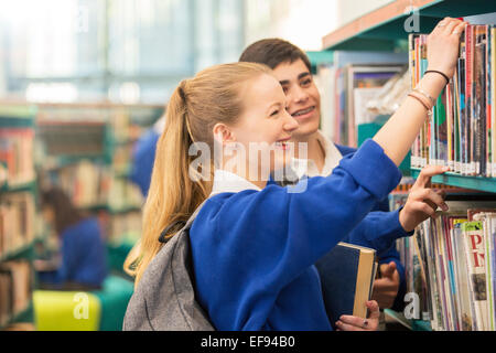 Students choosing books in library Stock Photo