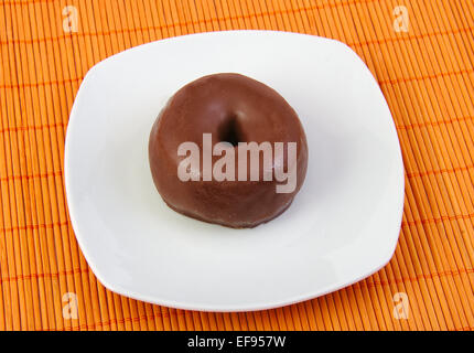 Chocolate doughnut, donut in a white dish Stock Photo