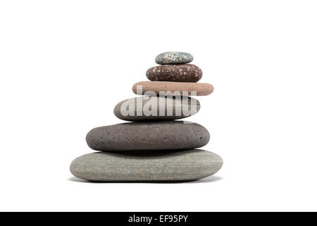 Slanting stone cairn made from a variety of colorful Lake Superior rocks.  Studio shot isolated on white. Stock Photo