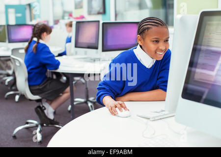 Elementary school children working with computers during IT lesson Stock Photo