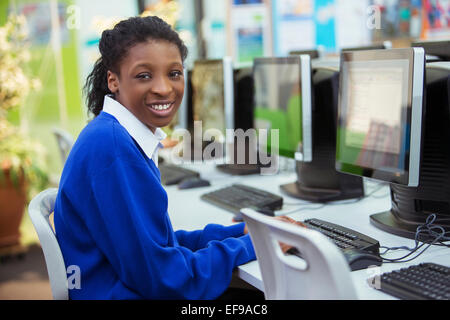 Portrait of smiling female student smiling during IT lesson Stock Photo
