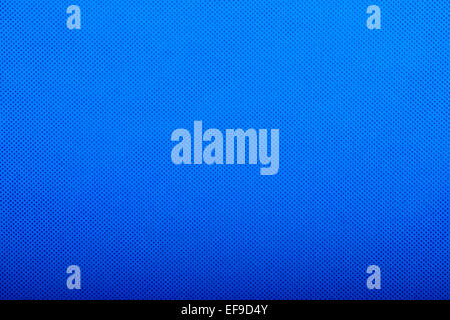 close up of grainy texture on bright blue fabric Stock Photo