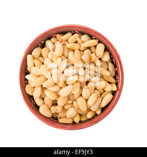 Bowl of pine nuts isolated on a white background Stock Photo